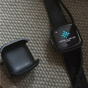 fitbit Versa Lite Black Silicone Smartwatch with Charger Cradle